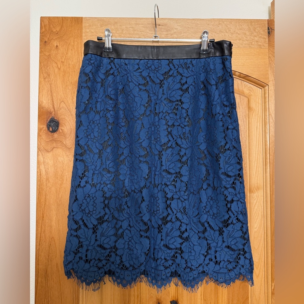 Blue lace skirt with faux leather trim